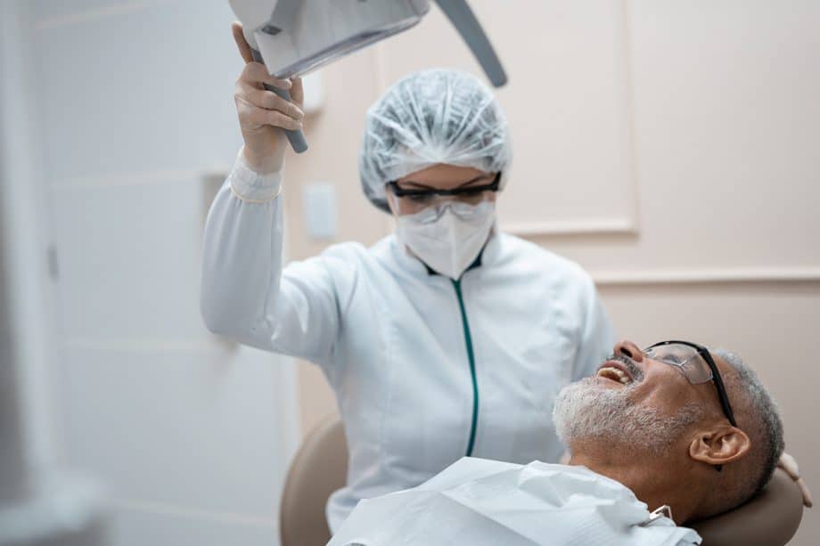 a dentist preps a patient for a root canal