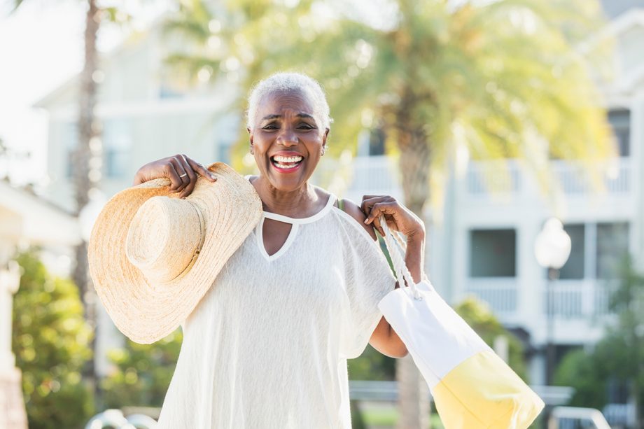 a woman smiles after her ZOOM teeth whitening